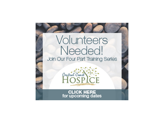 A sign that says volunteers needed and the words " hospice " are written in front of some rocks.